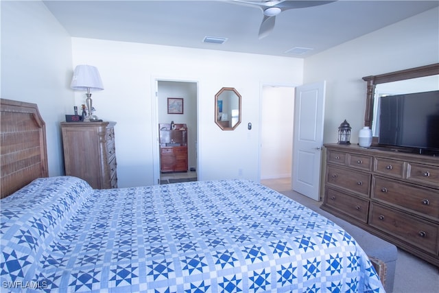 carpeted bedroom featuring connected bathroom and ceiling fan