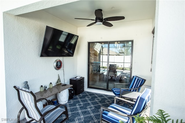 sitting room with ceiling fan