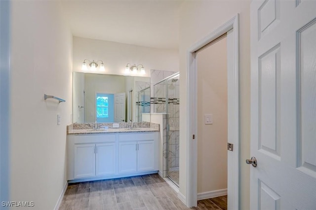 bathroom with vanity and walk in shower