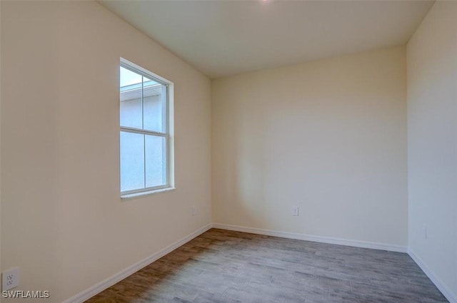 unfurnished room featuring light hardwood / wood-style flooring