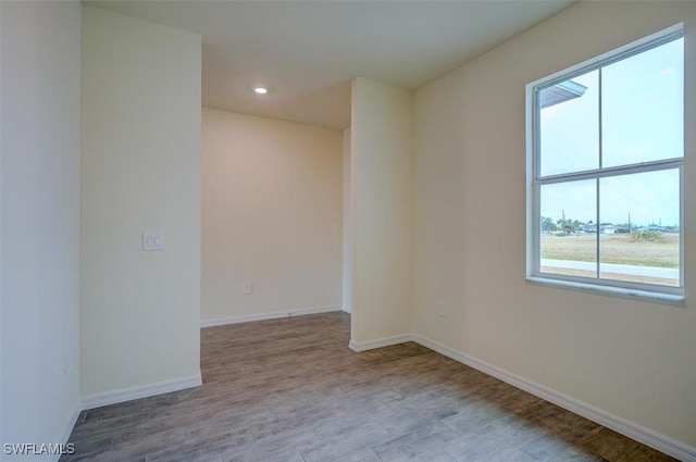 unfurnished room featuring light hardwood / wood-style floors