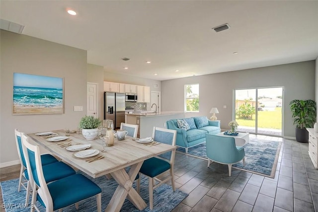 dining room featuring sink