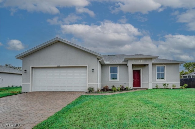 ranch-style home featuring a front lawn and a garage