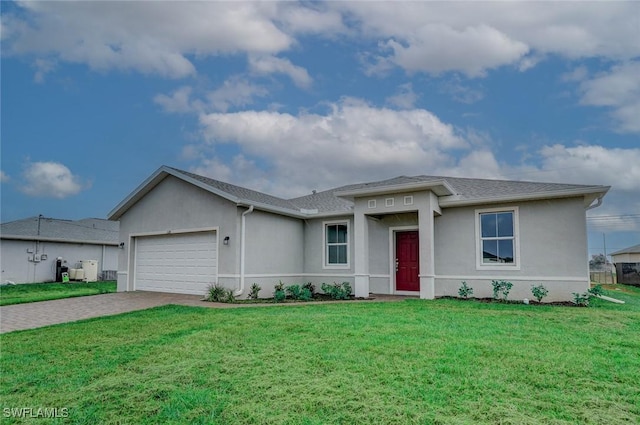 view of front of house with a front lawn and a garage