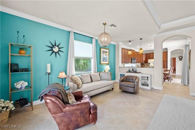 19550 Casa Bendita Ct, Estero, FL 33967 - living room with arched walkways, ornamental molding, and light tile patterned flooring