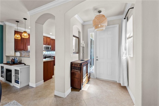 19550 Casa Bendita Ct, Estero, FL 33967 - entrance foyer featuring arched walkways, ornamental molding, and light tile patterned floors