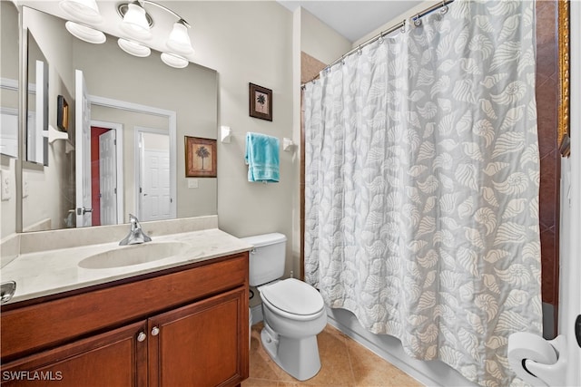 bathroom featuring tile patterned floors, toilet, and vanity