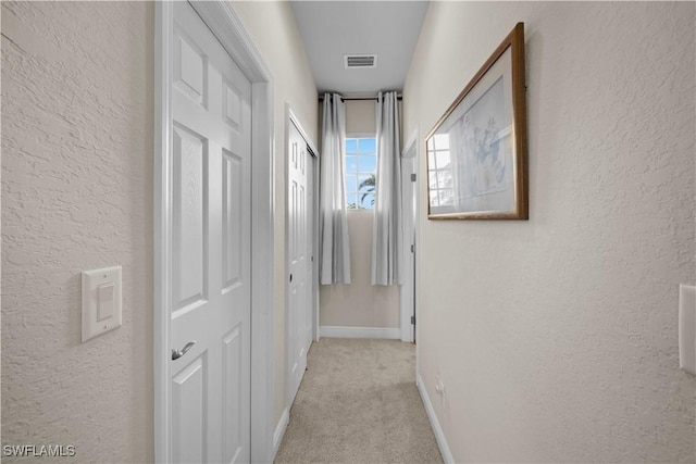 19550 Casa Bendita Ct, Estero, FL 33967 - hall featuring light colored carpet and a textured wall