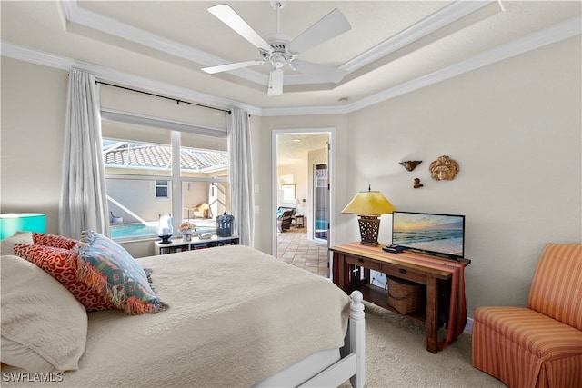 bedroom featuring a raised ceiling, ornamental molding, and ceiling fan