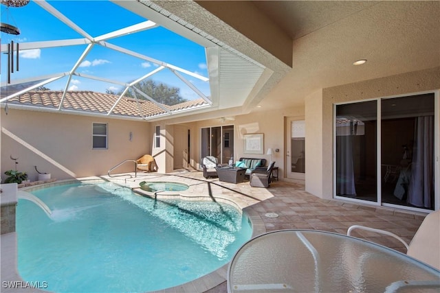 19550 Casa Bendita Ct, Estero, FL 33967 - view of swimming pool featuring a patio area, glass enclosure, a pool with connected hot tub, and an outdoor hangout area