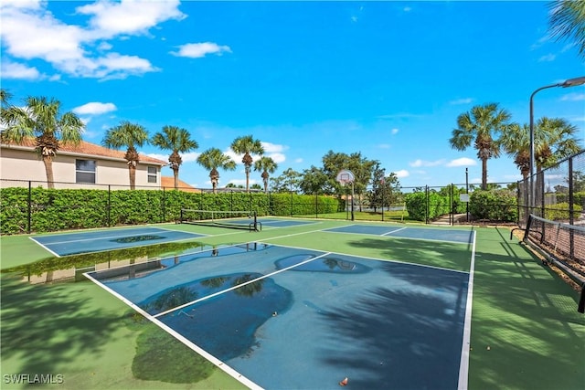 view of sport court featuring tennis court