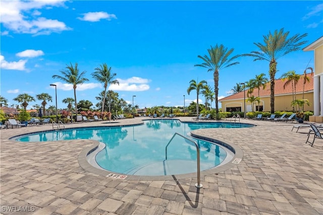 view of swimming pool featuring a patio area