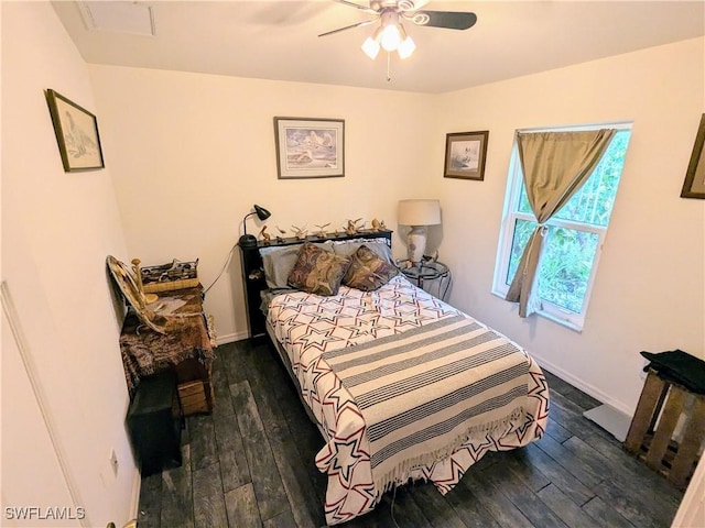 bedroom featuring dark hardwood / wood-style floors and ceiling fan