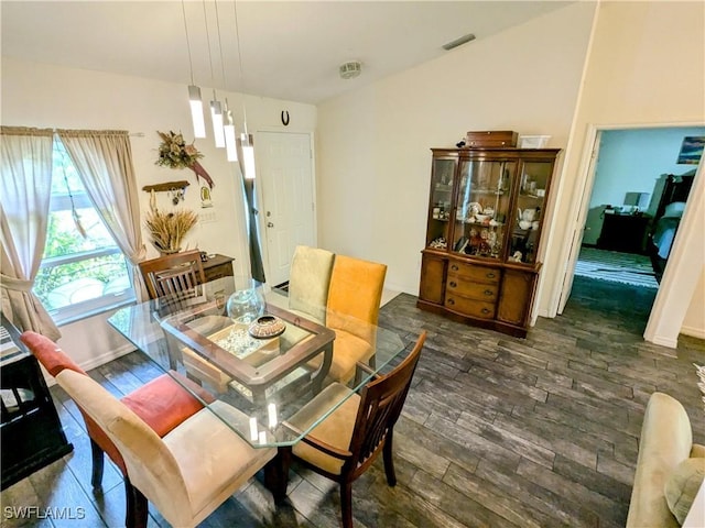 dining area featuring dark hardwood / wood-style floors