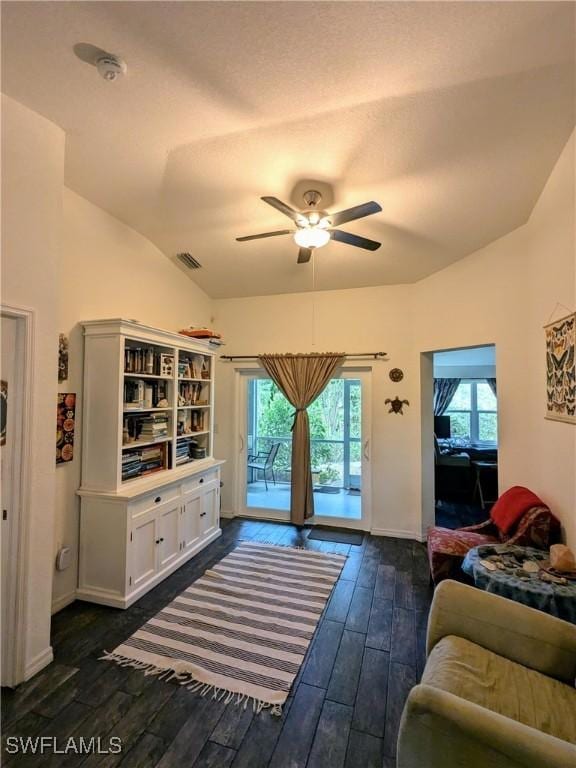 bedroom with access to outside, vaulted ceiling, ceiling fan, and dark hardwood / wood-style floors