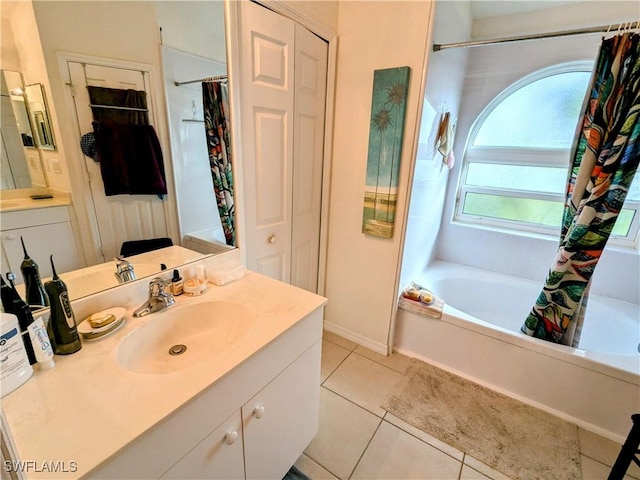 bathroom featuring tile patterned flooring and vanity