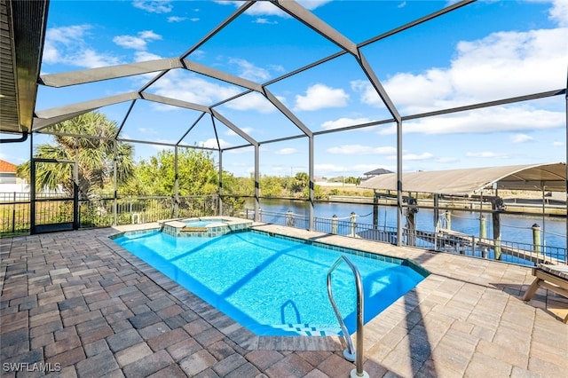 view of pool with glass enclosure, a dock, a water view, an in ground hot tub, and a patio