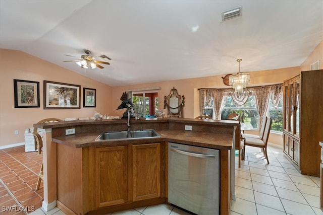 kitchen featuring stainless steel dishwasher, ceiling fan with notable chandelier, sink, hanging light fixtures, and lofted ceiling