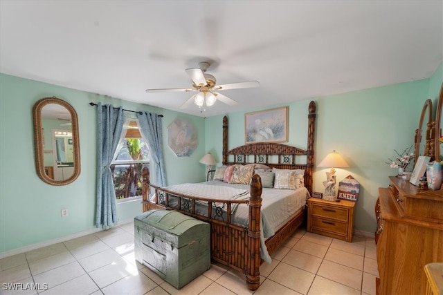 bedroom with ceiling fan and light tile patterned floors