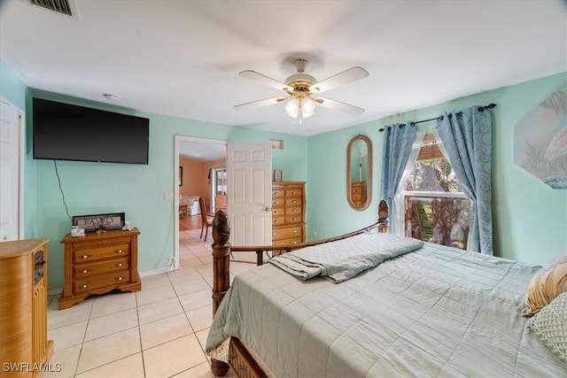 bedroom featuring light tile patterned floors and ceiling fan