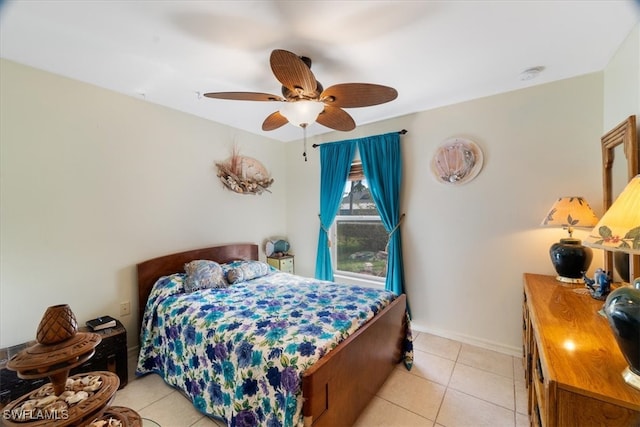 bedroom with light tile patterned floors and ceiling fan