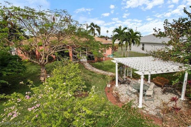 view of yard featuring a pergola and a patio