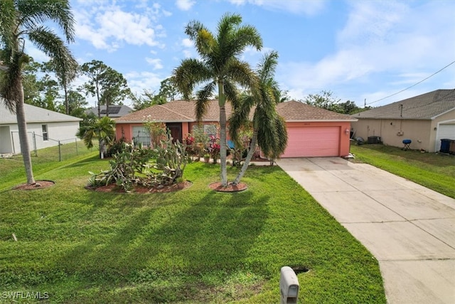 ranch-style house with a garage and a front yard