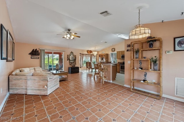 living room with ceiling fan and lofted ceiling