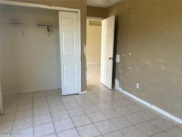 unfurnished bedroom with a closet