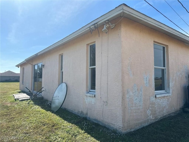 view of home's exterior featuring a yard