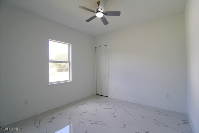 spare room featuring ceiling fan