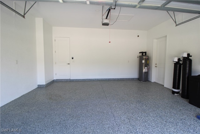 garage featuring water heater and a garage door opener