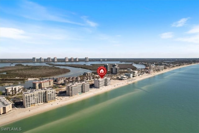 bird's eye view featuring a beach view and a water view