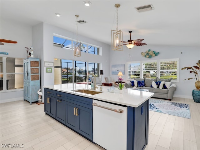 kitchen with dishwasher, a kitchen island with sink, ceiling fan with notable chandelier, hanging light fixtures, and sink