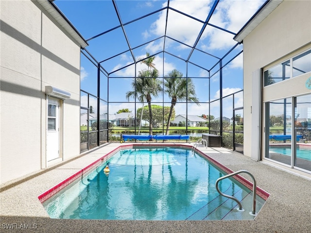 view of pool featuring a patio area and a lanai