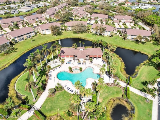 birds eye view of property featuring a water view