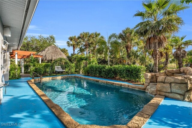 3930 24th Ave SE, Naples, FL 34117 - outdoor pool featuring a pergola