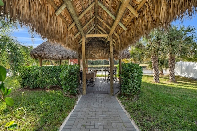 view of community with a gazebo, a patio, and a lawn