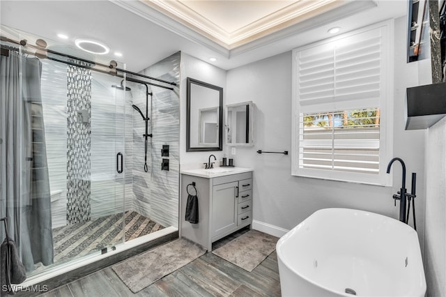 bathroom with hardwood / wood-style floors, vanity, shower with separate bathtub, and crown molding