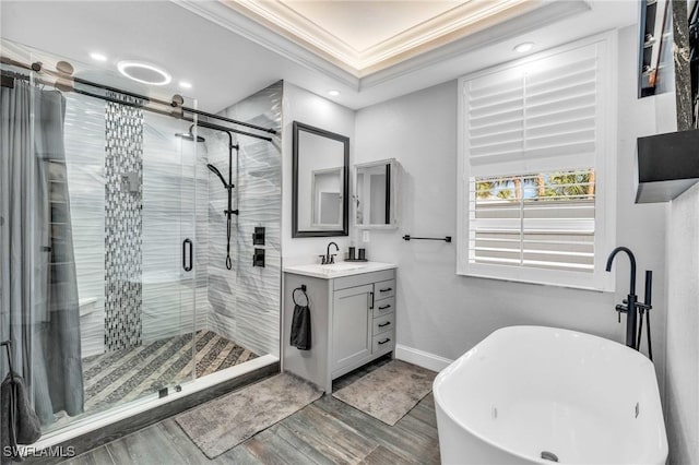3930 24th Ave SE, Naples, FL 34117 - bathroom featuring crown molding, wood finished floors, a shower stall, baseboards, and vanity