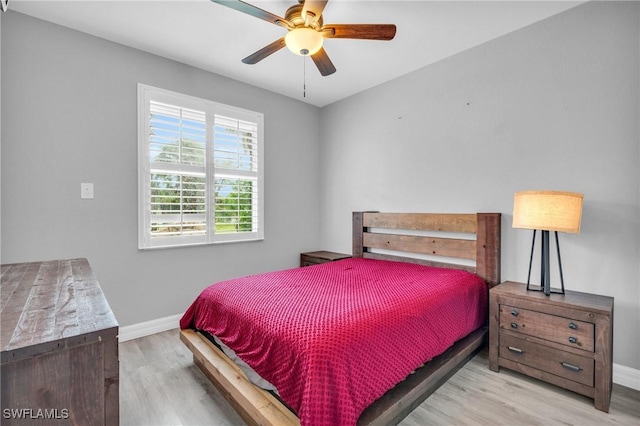 3930 24th Ave SE, Naples, FL 34117 - bedroom with wood finished floors, baseboards, and ceiling fan