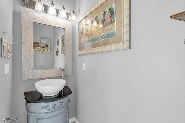 3930 24th Ave SE, Naples, FL 34117 - bathroom with vanity and baseboards