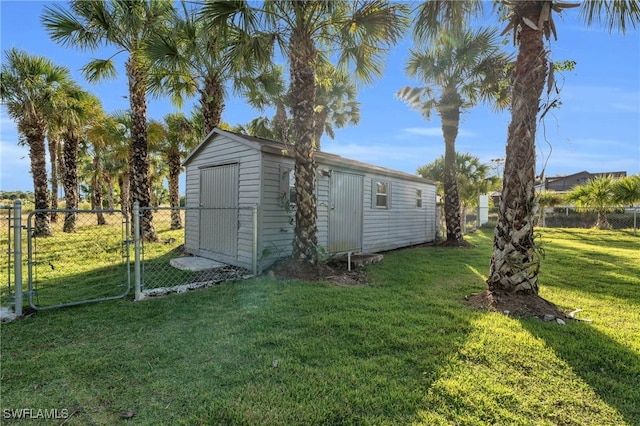 view of outbuilding featuring a lawn