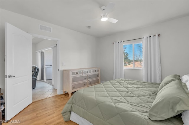 bedroom featuring light hardwood / wood-style flooring and ceiling fan