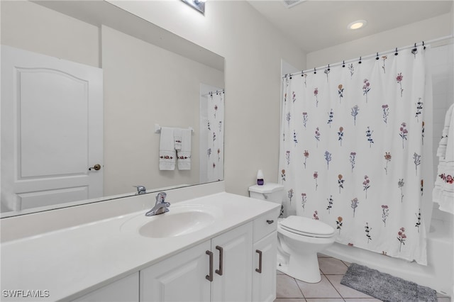 full bathroom featuring tile patterned flooring, vanity, toilet, and shower / bathtub combination with curtain