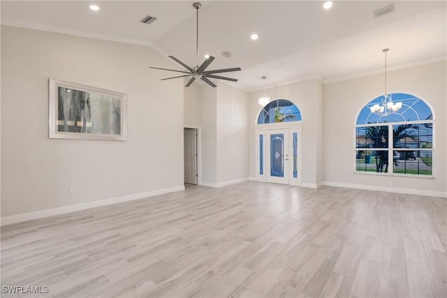 unfurnished living room with french doors, ornamental molding, ceiling fan with notable chandelier, high vaulted ceiling, and light hardwood / wood-style floors