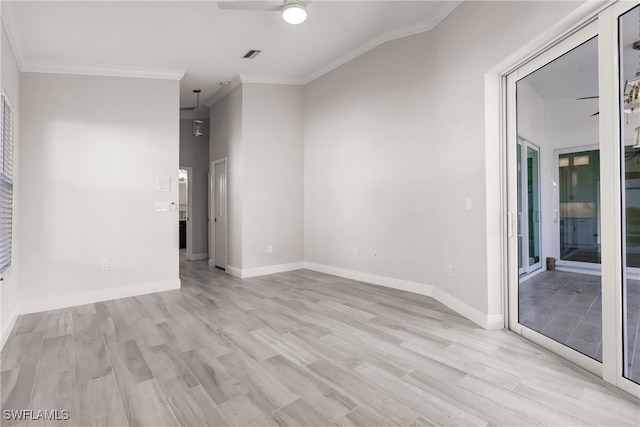 unfurnished room featuring light hardwood / wood-style floors, ceiling fan, and ornamental molding