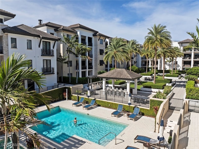 view of swimming pool with a gazebo and a patio area