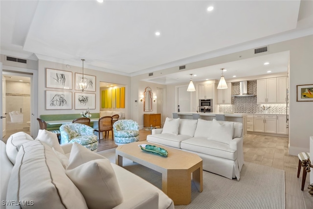 living room featuring a chandelier