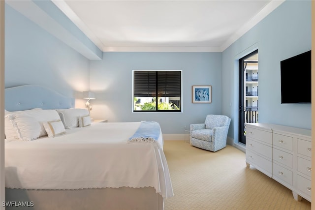 bedroom with crown molding and light colored carpet